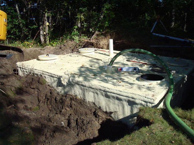 Concrete sewer chamber open with drain pipe inside